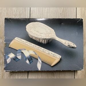 NEVER BEEN USED SILVER PLATED DRESSER SET 1 PIECE BRUSH AND 1 PIECE COMB.